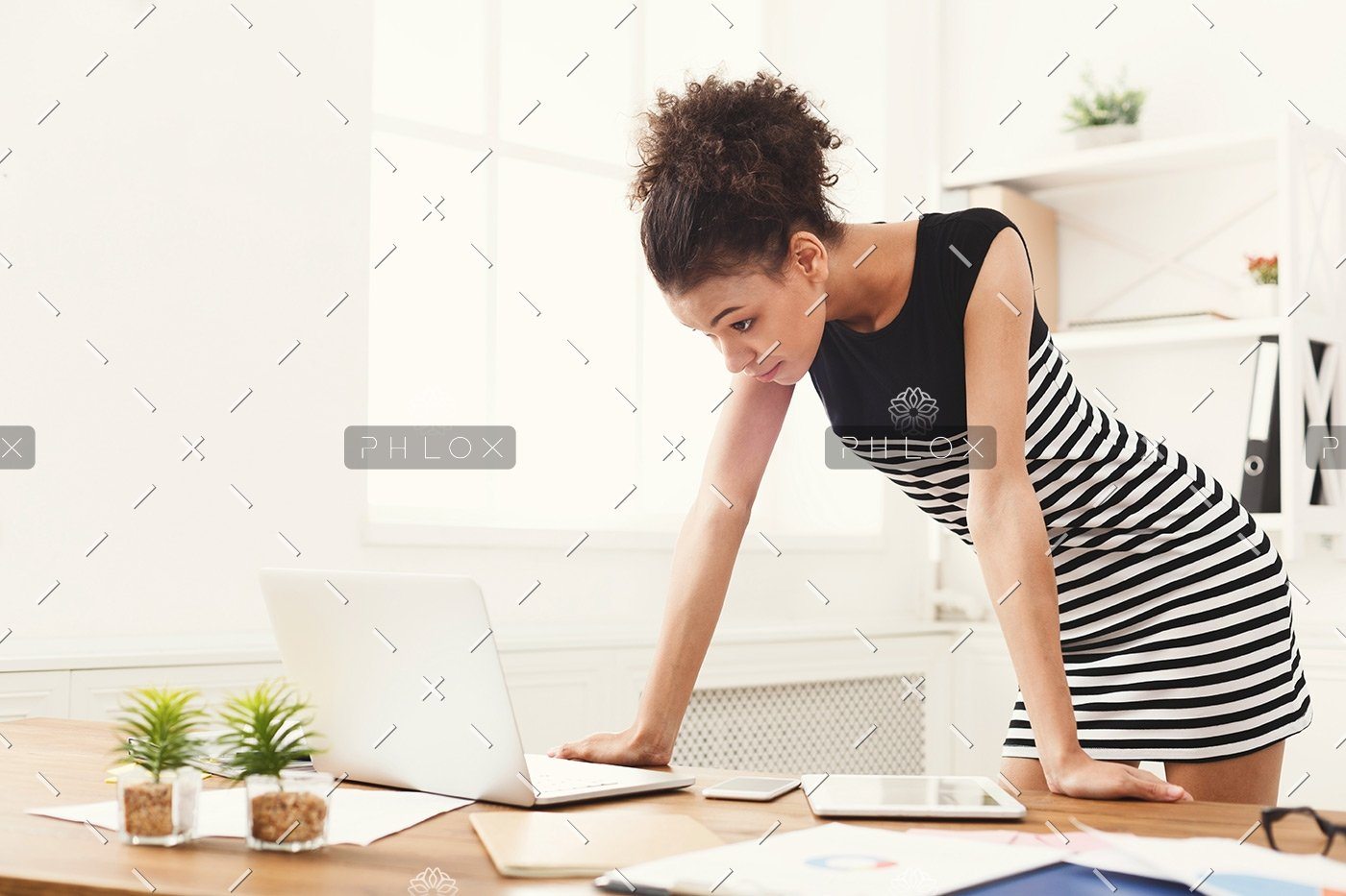 demo-attachment-170-business-woman-working-on-laptop-at-office-PRFJKQJ